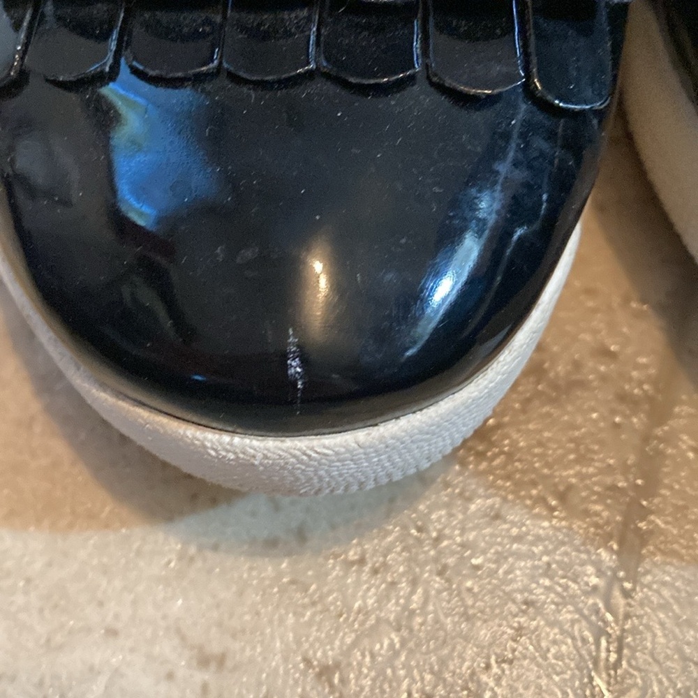 Fit flip black shiny frilly loafers style black shed with small mark on one toe. - Picture 3 of 10